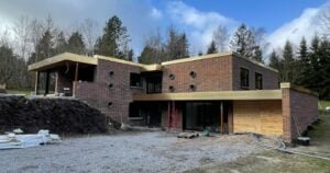 Modern brick house with circular windows.